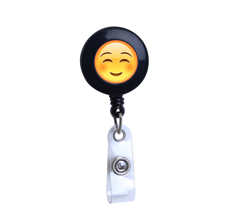 Blushing Emoji Black Plastic Badge Reel